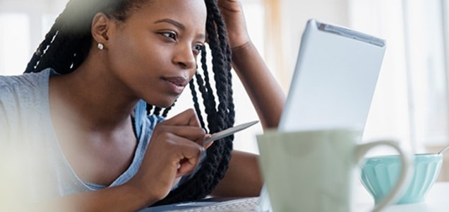 Women searching for insurance on computer